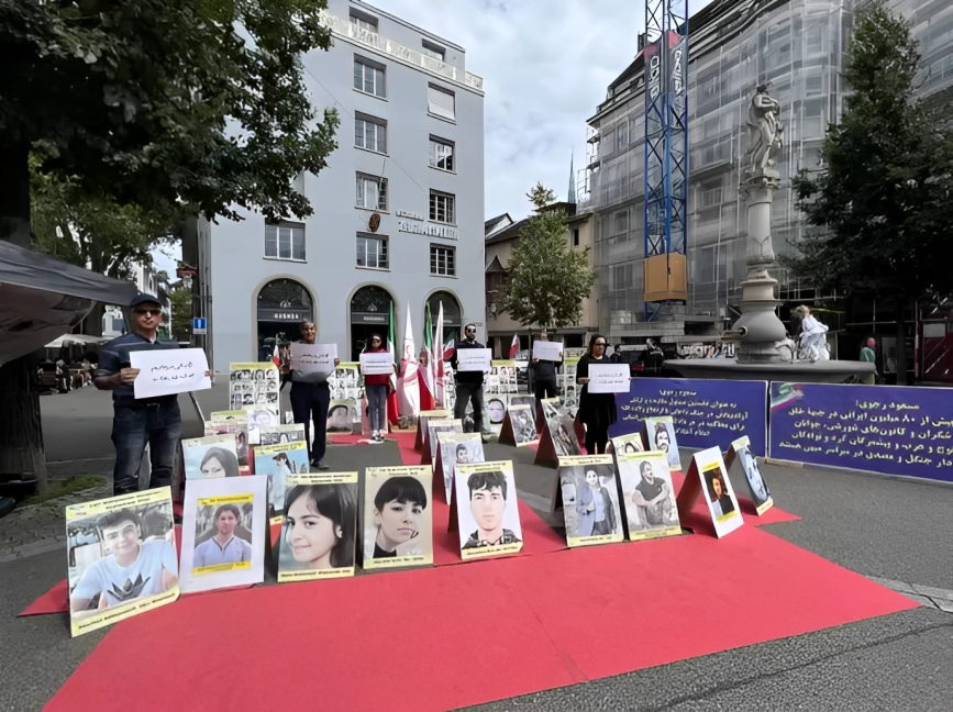 وقفة تضامنية لانصار مجاهدي خلق و إيرانيين احارا مع الانتفاضة الایرانیة في زيورخ