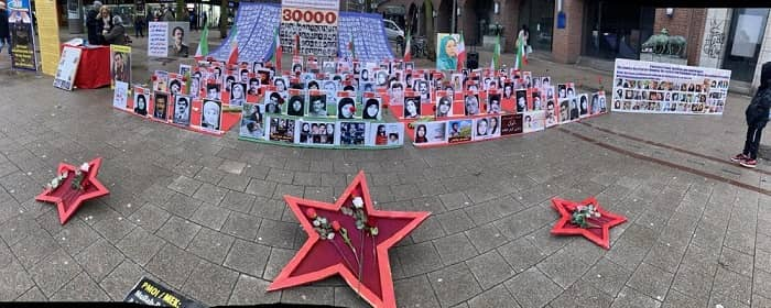 انصار مجاهدي خلق یقیمون معرض صور لشهداء الانتفاضة الوطنية الایرانیة في هامبورغ