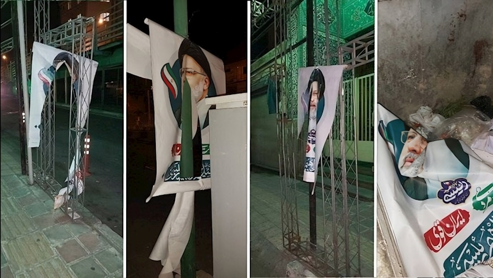 ایران... عشیة مسرحیة الانتخابات، المواطنون يمزقون ملصقات وصور الحملة الانتخابية للملالي