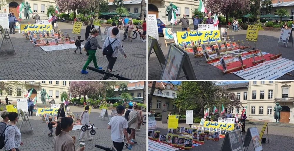 تضامنا مع انتفاضة الشعب الإيراني طاولة كتب ومعرض لصور شهداء الانتفاضة الإيرانية في هایدلبرغ- تقرير مصور