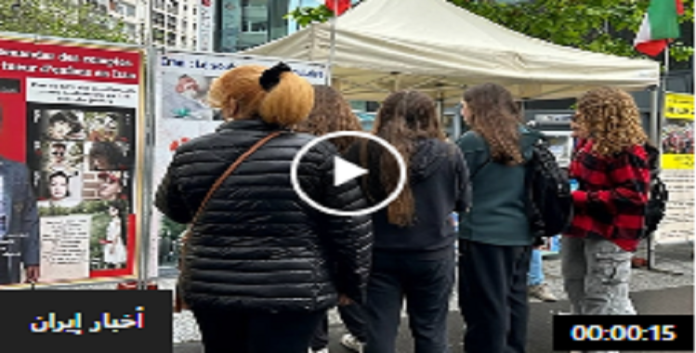 تکریماً لشهداء الانتفاضة الإيرانية طاولة كتب ومعرض لصورالشهداء فی باریس -تقریر مصور